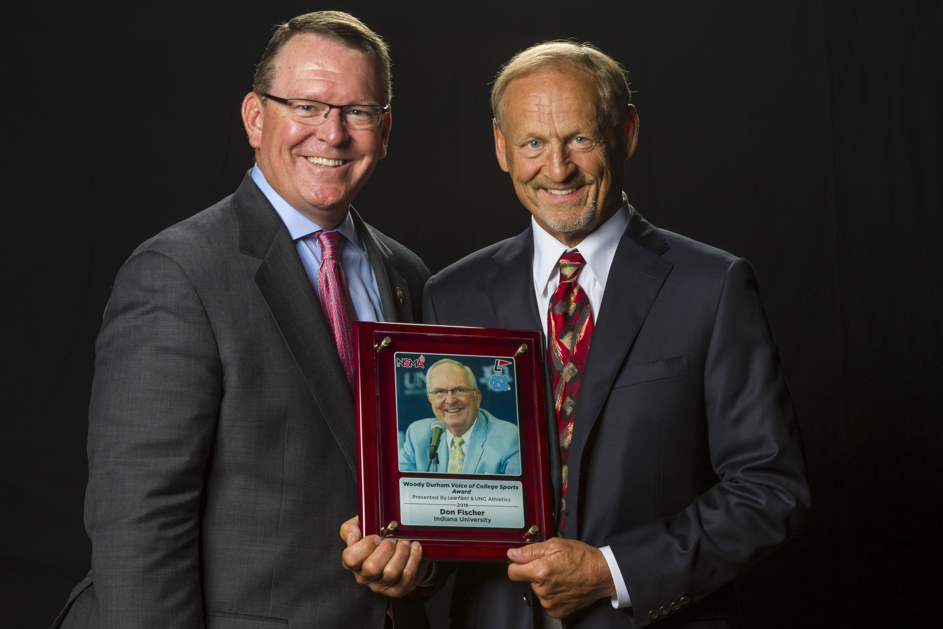 Wes Durham (left), son of the late Woody Durham, with Indiana University pay-by-play announcer Don Fischer, winner of the first Woody Durham Voice of College Sports Award