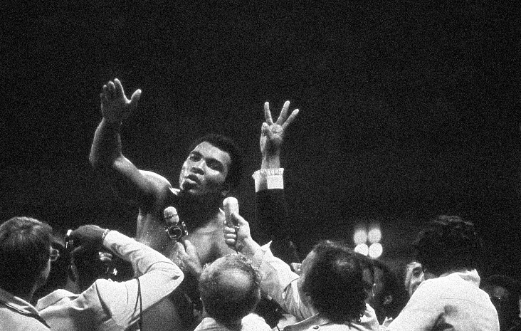 Muhammad Ali talks with the press after winning back the Heavyweight Championship for an unprecedented third time by beating Leon Spinks at the Super Dome in New Orleans, LA. September 15, 1978. Credit: Michael Gaffney
